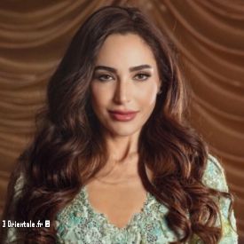 Abeer Nehme en robe vert clair Abeer Nehme en robe vert clair